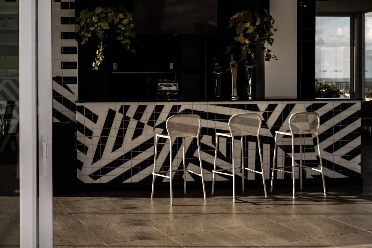 Be.Hotel St. Julian's Exteriör bild "The interior of the house is a combination of black and white tiles, and the furniture is also black and white."